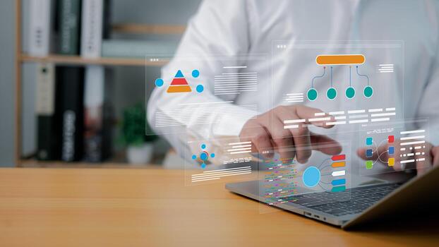 Business technology and data analysis. businessman using laptop with virtual analytics and infographic interface photo