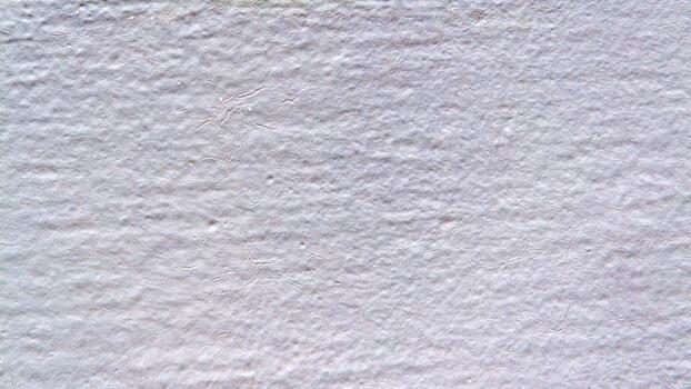 White plaster with a rough texture and barely noticeable cracks. A minimalist, light background for design, layout, or text overlay. photo