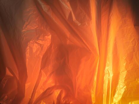 Textured orange plastic with wet droplets for environment theme photo