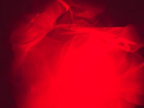 Dark background with mysterious red light on plastic texture photo