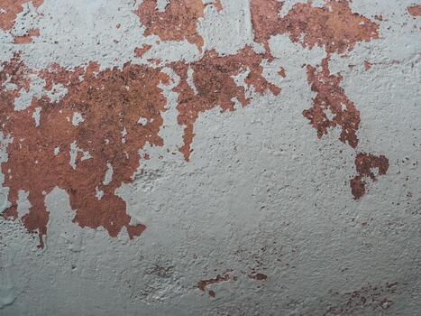 Worn-out facade with paint on old building surface photo