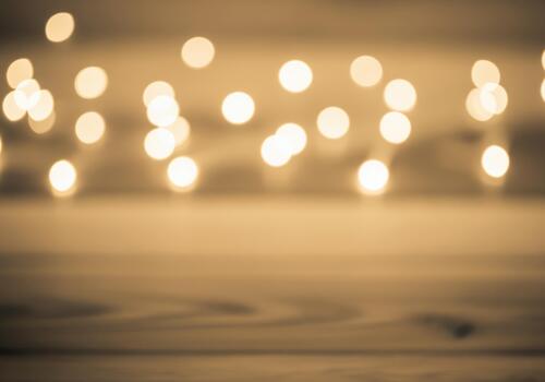 Abstract background of soft golden bokeh lights creating a warm festive mood. photo