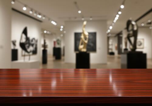 Polished dark wood countertop product display in a sophisticated museum setting photo
