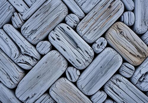 Weathered gray driftwood mosaic pattern creating a unique natural texture background. photo