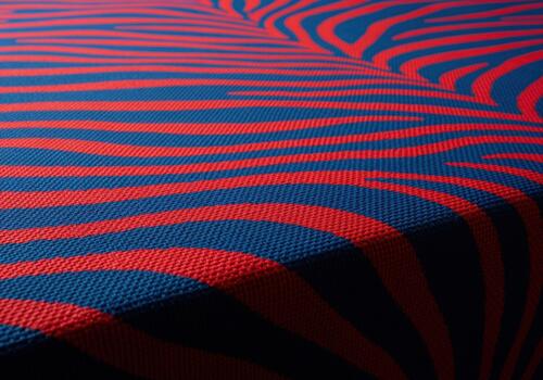 Abstract textile pattern featuring intense red and dark blue zebra stripes on rough canvas photo