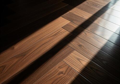 Dark espresso walnut hardwood floor in herringbone pattern with dramatic sunlight and shadow contrast photo