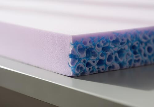 Detailed macro view of cooling gel infused memory foam mattress topper material photo