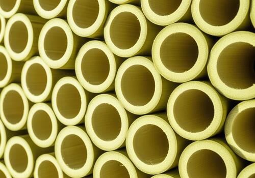 Highly detailed abstract pattern of fresh green bamboo cross sections bundled together photo