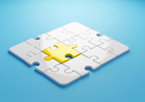 Unique yellow puzzle piece completing the white grid on a vibrant blue surface photo
