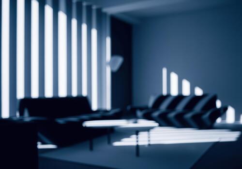 Blurred interior of a modern scandinavian style loft with dramatic light and shadow patterns photo