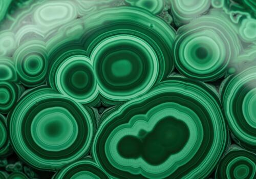 Vibrant green malachite stone texture closeup showing concentric rings and banded patterns photo