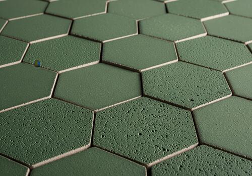 Continuous pattern of alternating smooth and textured dark green hexagonal tiles photo