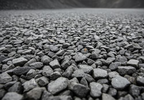 Detailed texture of dark gray angular gravel aggregate surface background material. photo