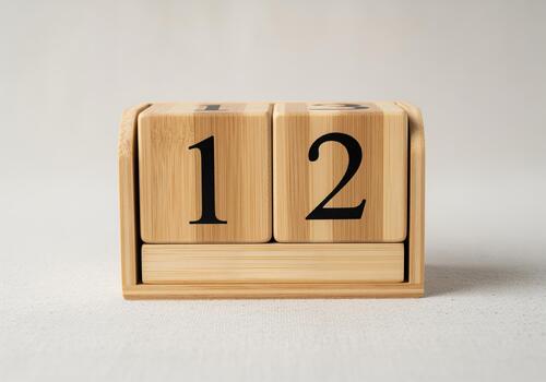 Bright commercial photograph of a natural bamboo calendar showing the date 12. photo