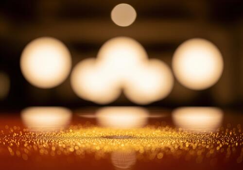 Luxurious golden glitter surface with warm soft focus bokeh light background photo
