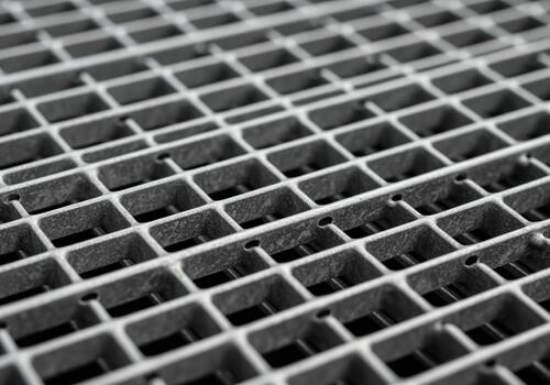 Detailed industrial metal grate texture pattern close up of a galvanized grid structure. photo