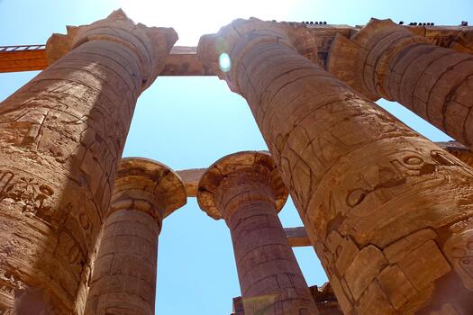 Exploring the Majestic Columns of the Karnak Temple Complex in Ancient Egypt Under Bright Sunlight photo