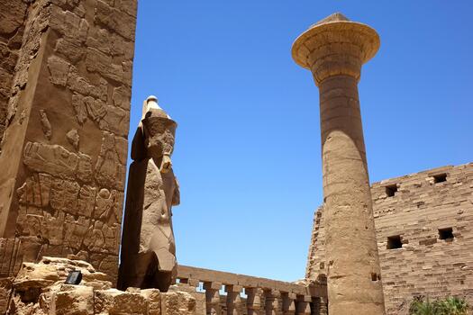 Exploring the Ancient Ruins of Karnak Temple Complex With Towering Columns and Intricate Statues photo