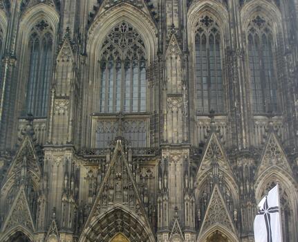 Cologne Cathedral Facade Showcasing Intricate Gothic Architecture and Stunning Stonework Details photo