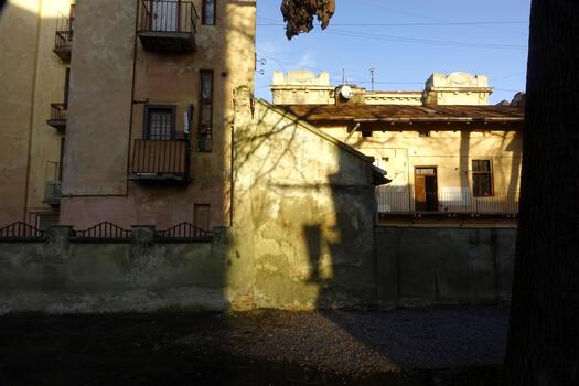 Old Buildings Casting Shadows in Lviv During Late Afternoon Light photo