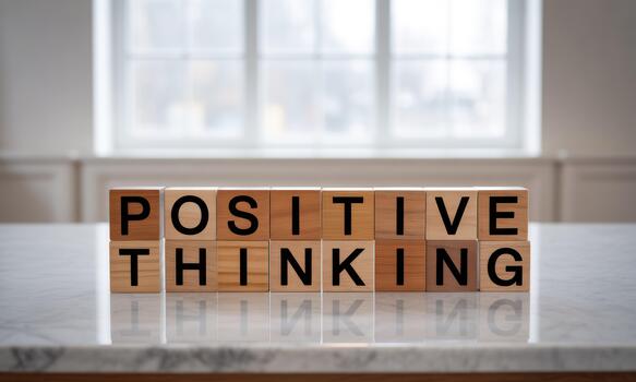 Positive thinking block on a table photo