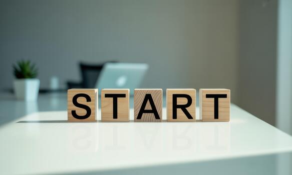 Start block on white desk with laptop and coffee photo