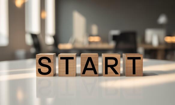 Start block on white table with office background photo