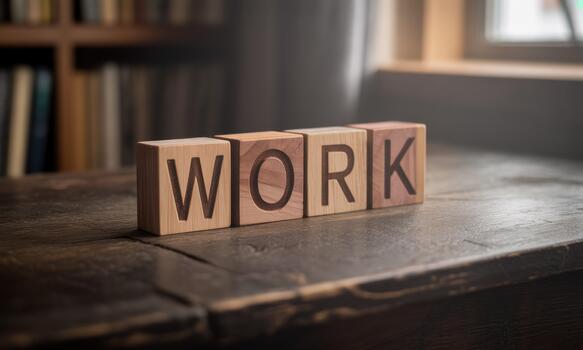 Wooden blocks spelling the word work on a desk photo