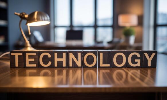 Technology word on wooden blocks on desk photo