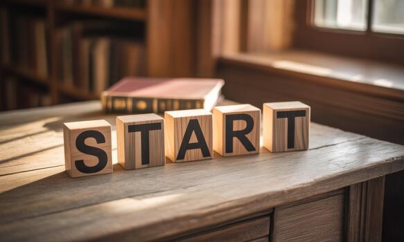 Start block on wooden table photo