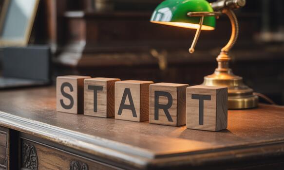 Start block on desk with lamp and wooden desk photo