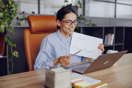 A professional woman analyzes complex data in an office, using analytics to enhance productivity photo