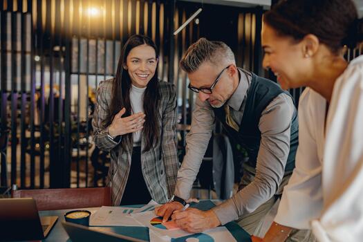 Engaging in a Collaborative Business Meeting that includes Team Discussions and Informative Charts photo