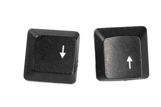 Keyboard keys showing up and down arrows on a light background photo