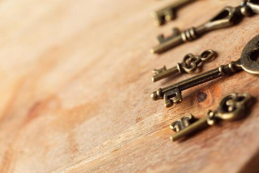 Old vintage keys placed on a wooden surface create an interesting visual display photo