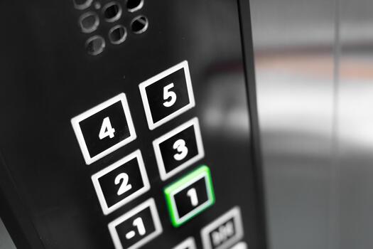 Elevator control panel showing pressed button in a modern building photo
