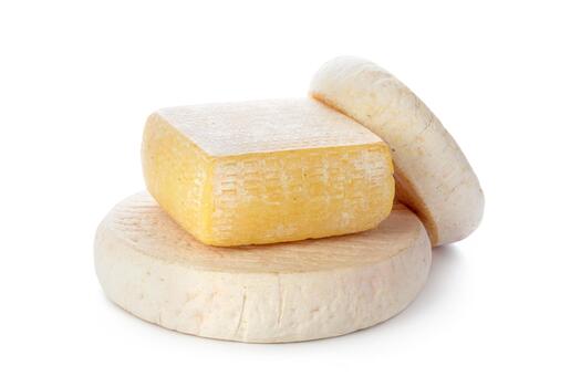 Varieties of cheese stacked on a white background showing texture and color differences photo