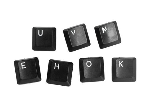 Unique collection of black keyboard keys arranged creatively on a white background photo