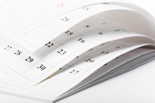 Calendar pages turned over with dates clearly visible in close-up view photo