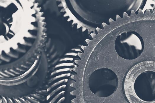 Close-up view of assorted metallic gears in various sizes and shapes photo