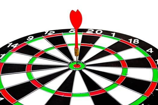 Dart hits bullseye in a game of skill symbolizing success and precise targeting photo