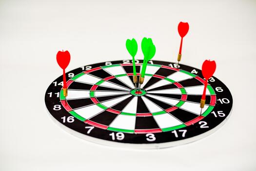 Dartboard with Darts in the Bullseye Showing Accuracy and Precision on White Background photo
