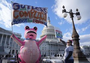 Protesters outside as Democratic House Leader Hakeem Jeffries leads a press conference on the House Steps at the United States Capitol as members return after a 54-day break, before House lawmakers take up legislation that would end the longest government shutdown in American history and vote on the Senate-passed spending deal.. editorial_image