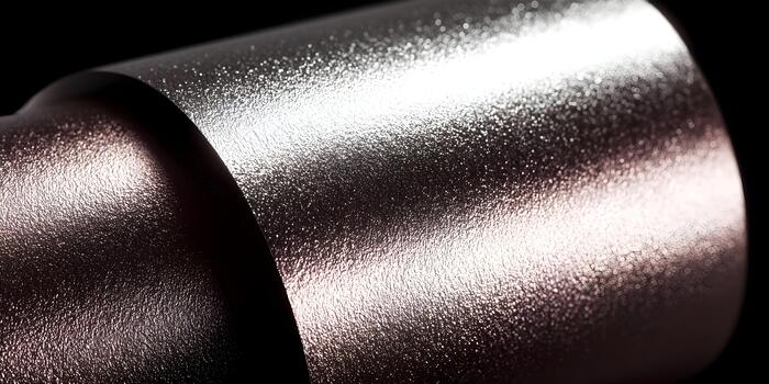 Abstract image of a sparkling granular surface showing metallic curves and light reflections photo