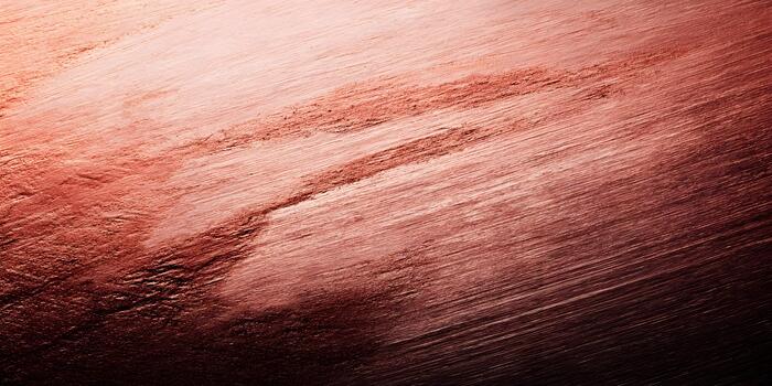 Abstract background with diagonal brush strokes in shades of copper and reddish brown creating a textured effect photo