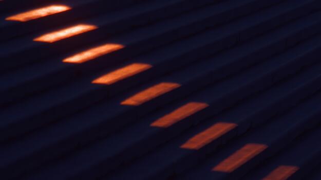 Sunset glow reflecting on textured surface photo