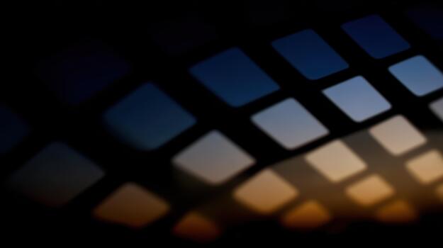 Dramatic sunset behind a patterned window grid photo