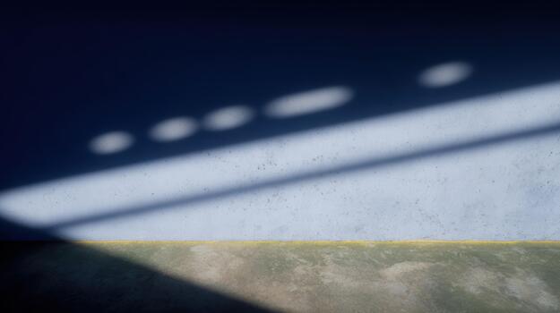 Shadows cast on a textured wall and floor at sunset photo