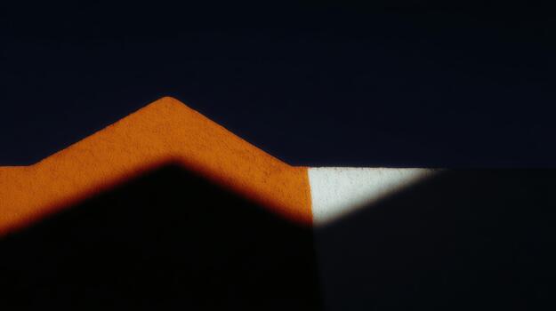 Unique geometric shapes with shadows on a surface photo