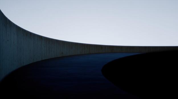 Curved concrete pathway in a serene setting at dusk photo